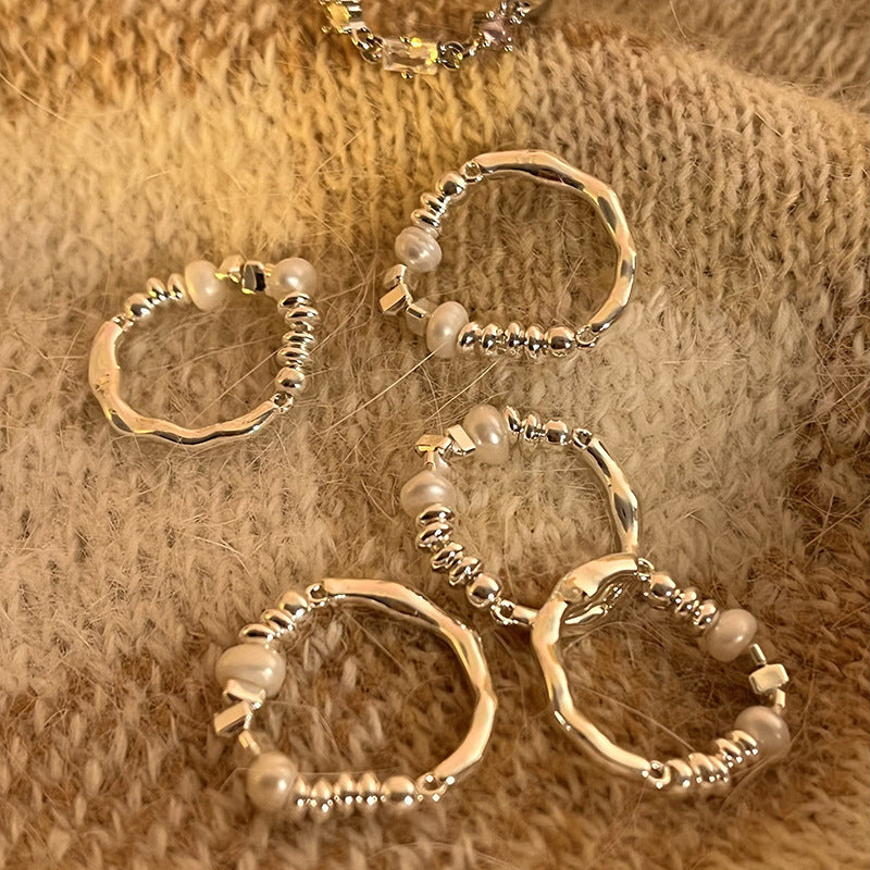 Boucles d'oreilles pour femme avec perles et design en argent