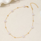 Collier élégant perles et chaîne dorée