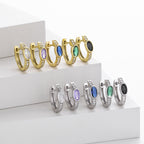 Boucles d'oreilles pendantes avec zircon ovale et monture en argent 925 doré