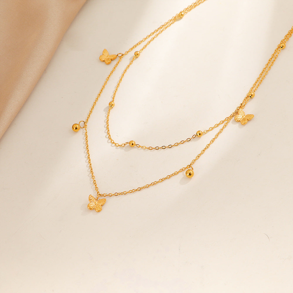 Collier délicat pour femme avec pendentifs papillons superposés