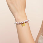 Bracelet pour femme au design floral avec accents dorés