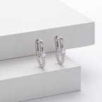 Boucles d'oreilles pendantes pour femme au design torsadé avec zircon