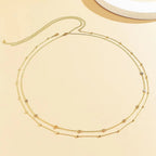 Collier superposé à breloques