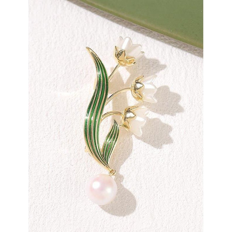 Broche fleur élégante avec pendentif perle