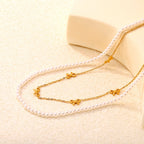 Collier multicouche pour femme avec perles délicates et pendentifs nœuds