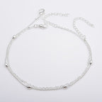 Bracelet de cheville délicat à chaînes superposées