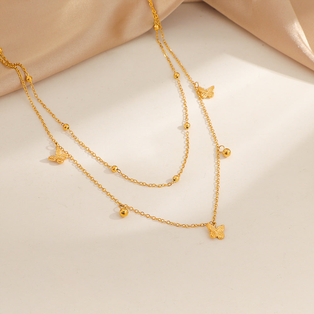 Collier délicat pour femme avec pendentifs papillons superposés