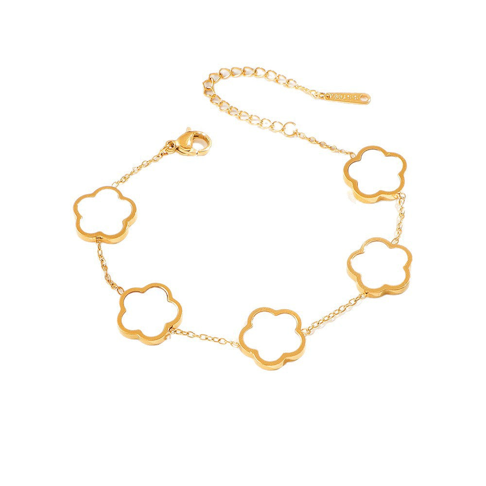 Bracelet chaîne dorée à motif floral pour femme