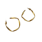 Boucles d'oreilles pour femme au design artistique et incurvé