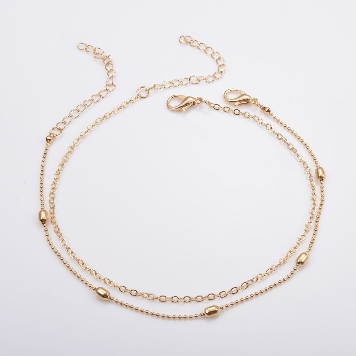 Bracelet de cheville délicat à chaînes superposées
