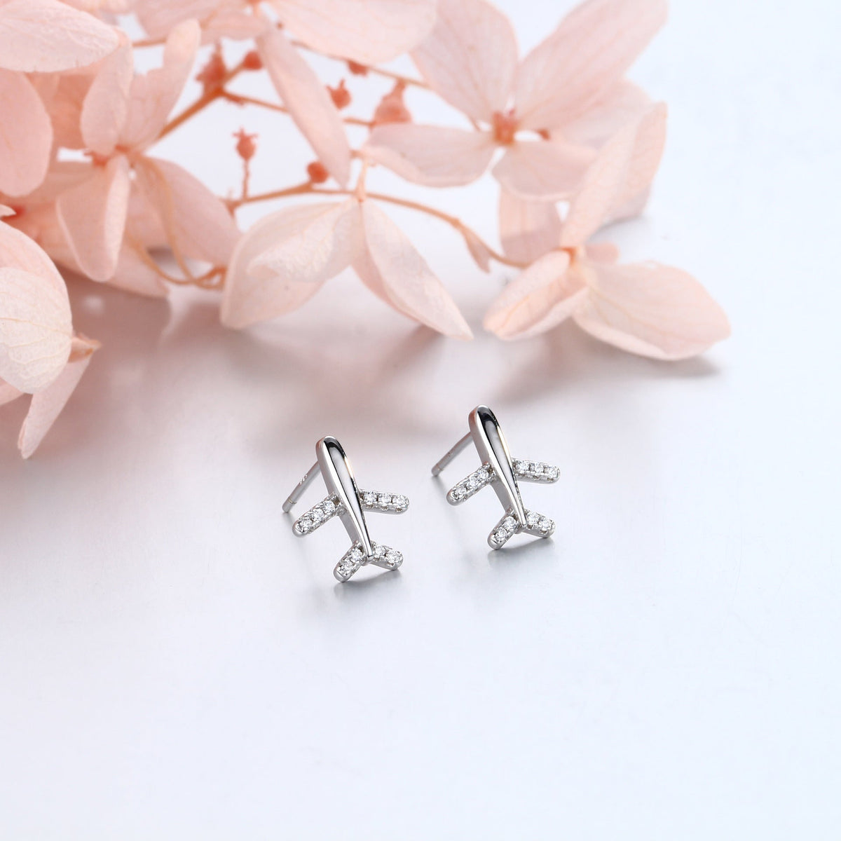 Clous d'oreilles pour femme design avion moderne avec strass