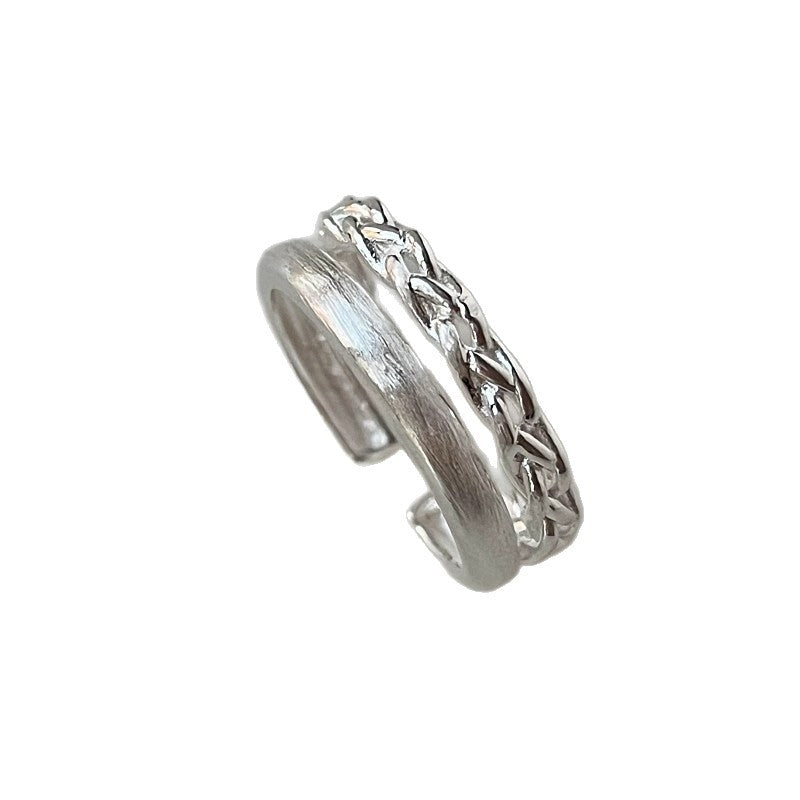 Bague ouverte en argent pour femme avec design tressé et brillant
