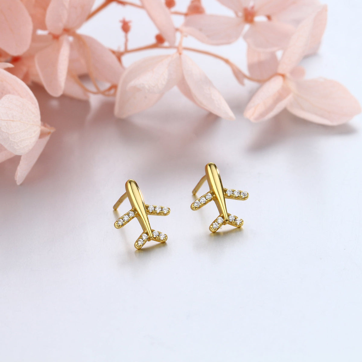 Clous d'oreilles pour femme design avion moderne avec strass