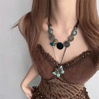 Collier long avec pendentif floral