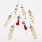 Boucles d'oreilles pendantes avec médaillon émaillé et franges de perles