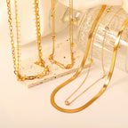 Collier pour femme avec motifs d'yeux et chaîne en acier inoxydable doré