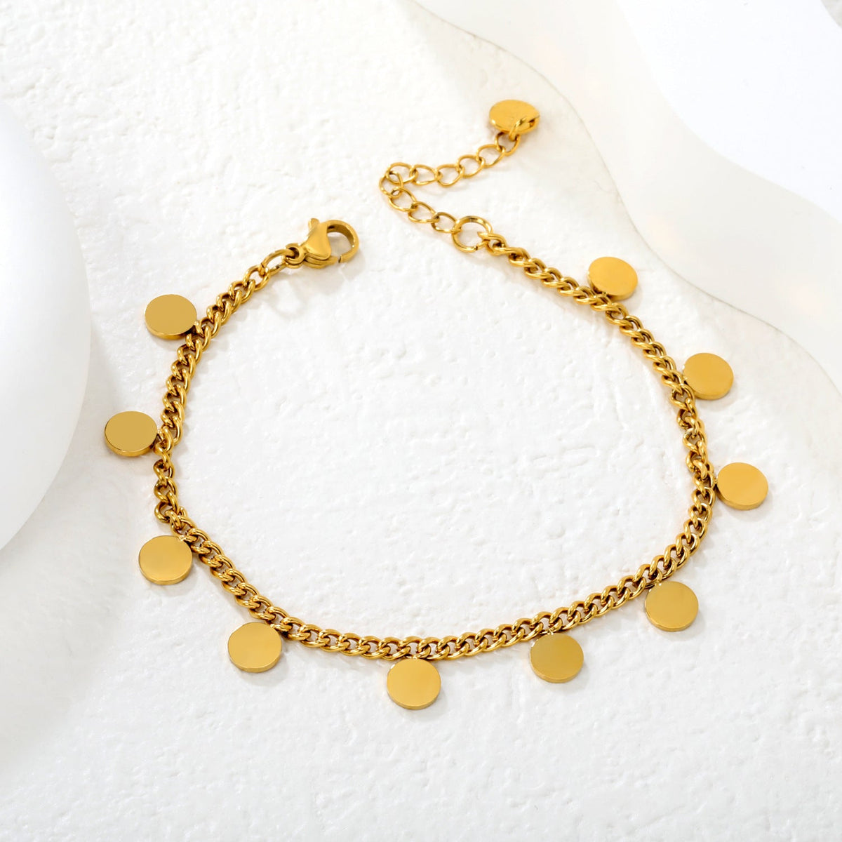 Bracelet élégant pour femme avec pendentifs ronds en acier inoxydable