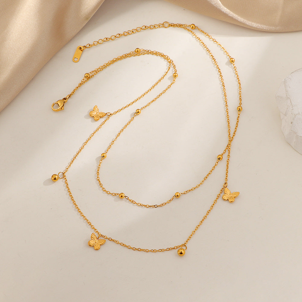 Collier délicat pour femme avec pendentifs papillons superposés