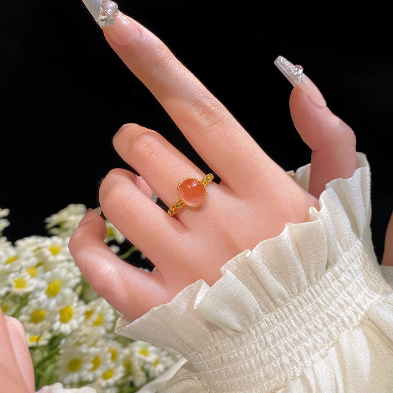 Bague pour femme avec quartz rose ovale et design doré