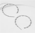 Boucles d'oreilles pour femme au design incurvé moderne