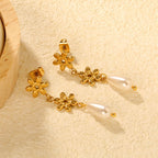 Boucles d'oreilles pendantes pour femme avec design floral et perles