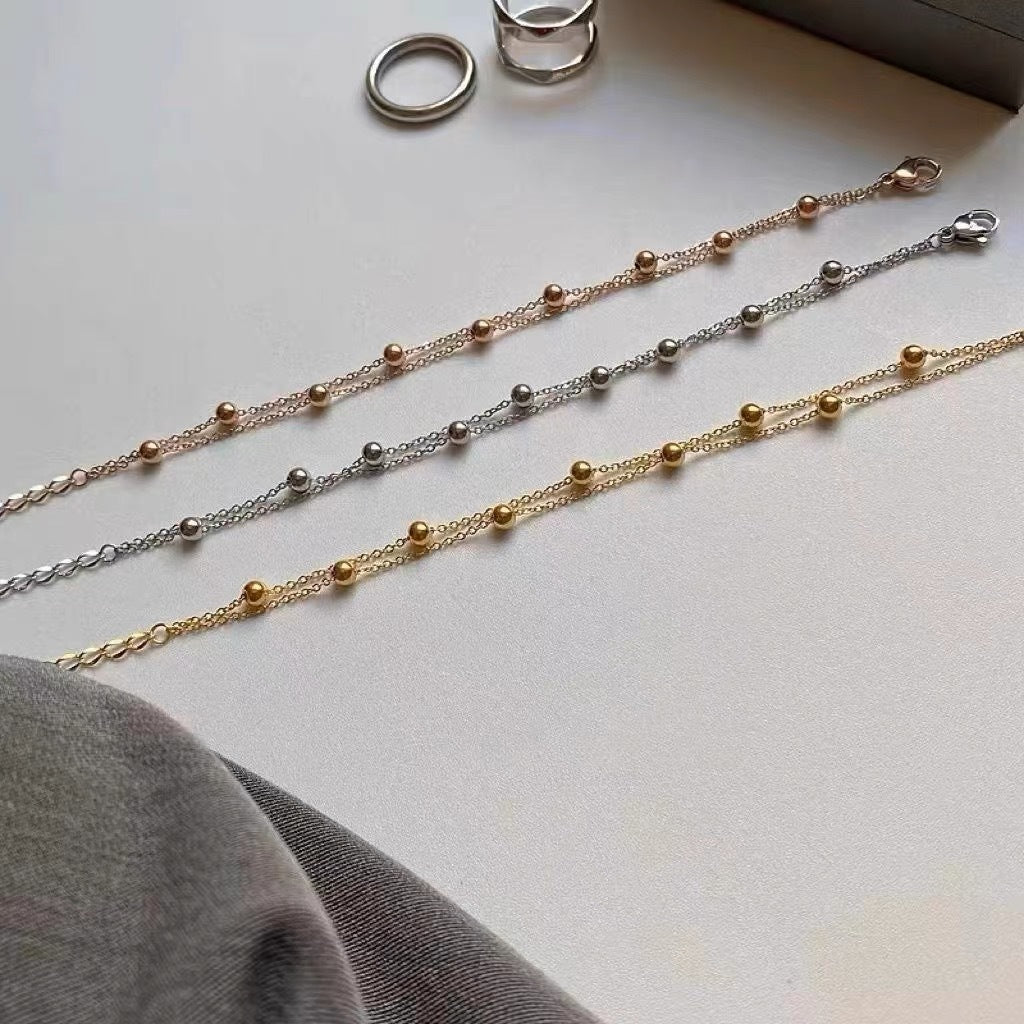 Bracelet double rang avec perles pour femme