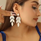 Boucles d'oreilles pendantes pour femme motif feuille