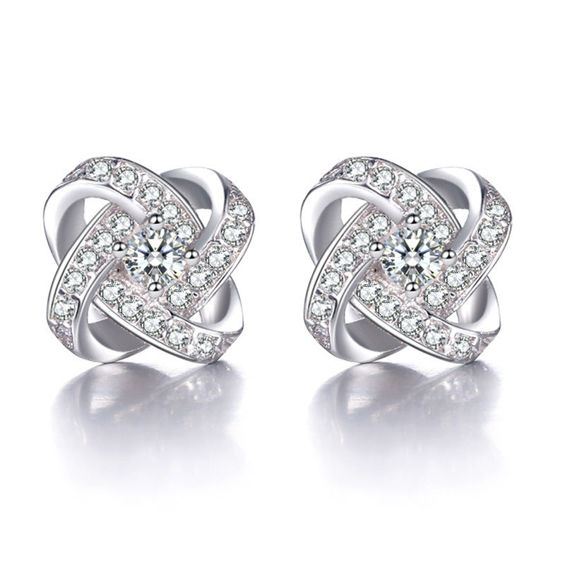 Boucles d'oreilles nœud en cristal étincelant avec insert en zircone