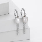 Boucles d'oreilles pendantes avec perle
