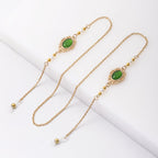 Boucles d'oreilles pendantes perles et pierres vertes