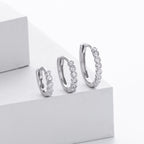 Boucles d'oreilles pendantes avec zircons modernes