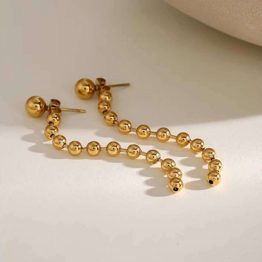 Boucles d'oreilles pompons perles dorées