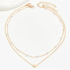 Collier ras-du-cou perles et cœur pour femme