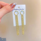 Boucles d'oreilles à pompons dorés