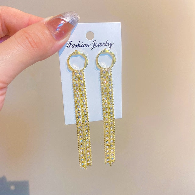Boucles d'oreilles à pompons dorés