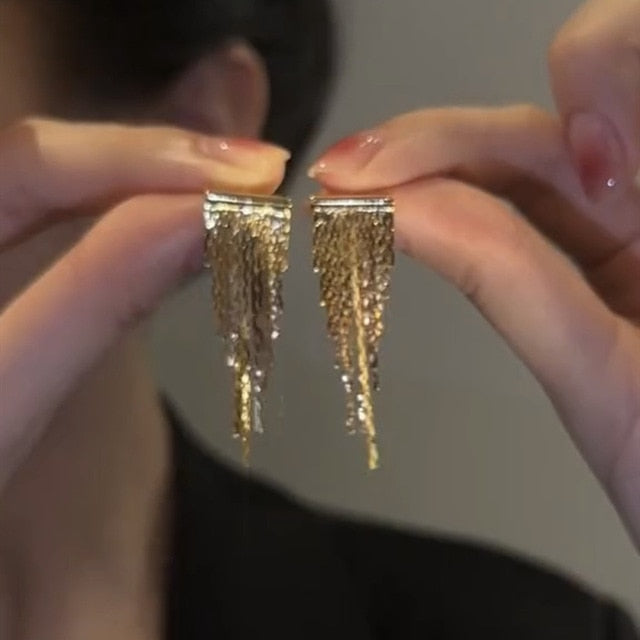 Boucles d'oreilles à pompons dorés