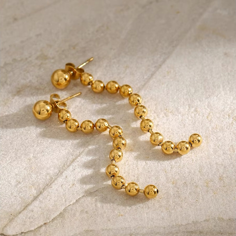 Boucles d'oreilles pompons perles dorées