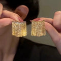 Boucles d'oreilles à pompons dorés