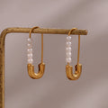 Boucles d'oreilles épingle à nourrice perle 18k