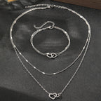 Parure collier et bracelet cœurs entrelacés
