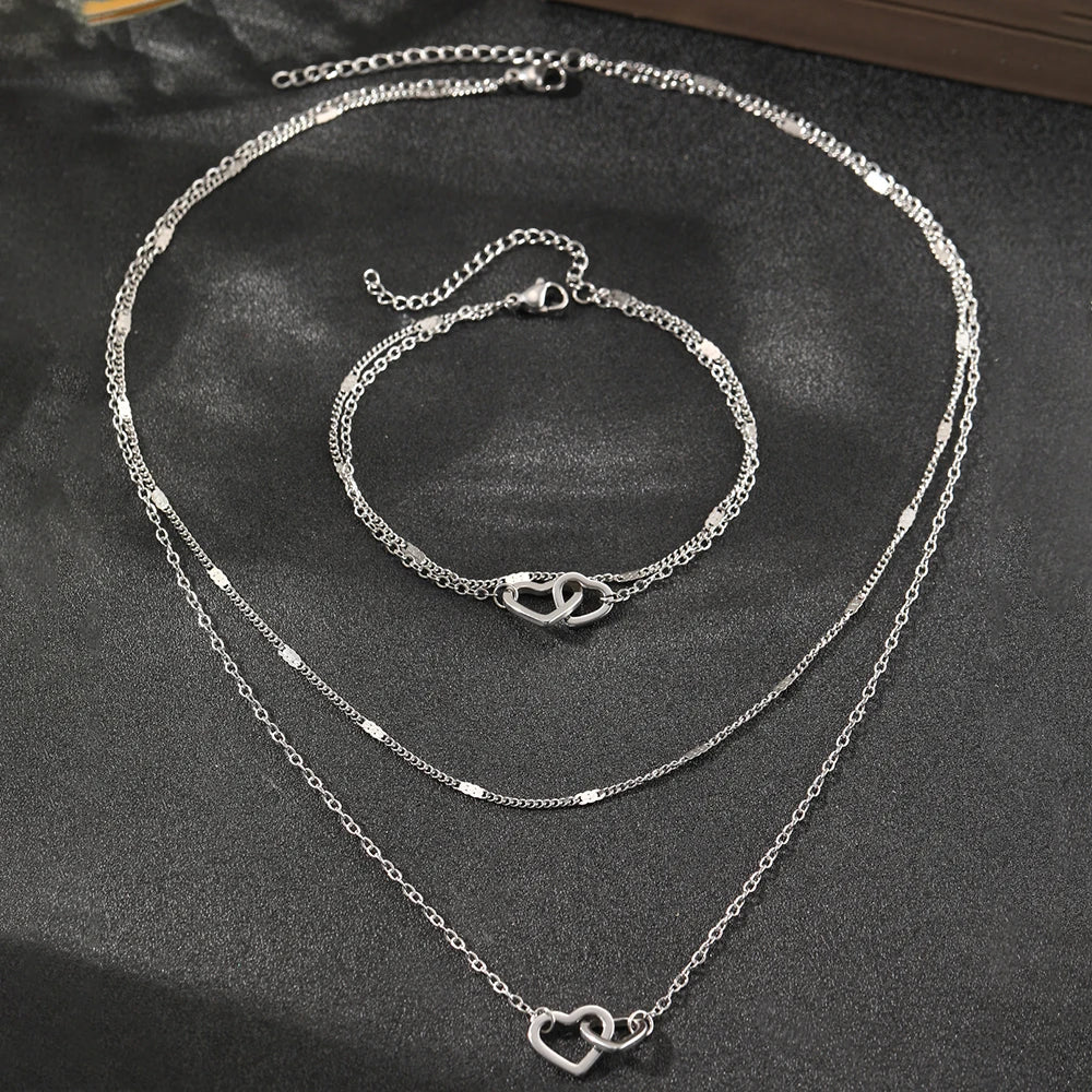 Parure collier et bracelet cœurs entrelacés