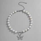 Collier ras-de-cou pendentif papillon et perles