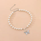Collier ras-de-cou pendentif papillon et perles
