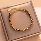 Bracelet en cuir tressé, chaîne dorée et noire
