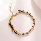 Bracelet en cuir tressé, chaîne dorée et noire