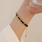 Bracelet en cuir tressé, chaîne dorée et noire