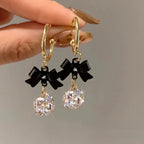 Boucles d'oreilles pendantes nœud et diamant