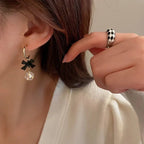 Boucles d'oreilles pendantes nœud et diamant