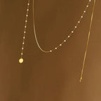Collier superposé à chevrons et perles
