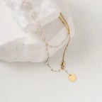 Collier superposé à chevrons et perles